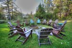 Fire pit Encircled with Adirondack Chairs Facing The Lake and Mountains